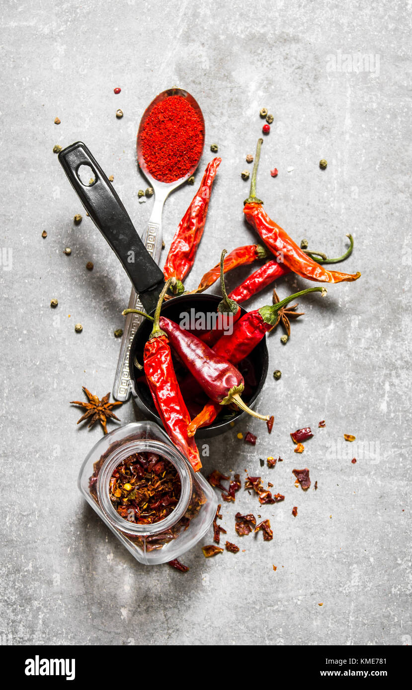 Dried peppers in a jar. On a stone background. Top view Stock Photo - Alamy