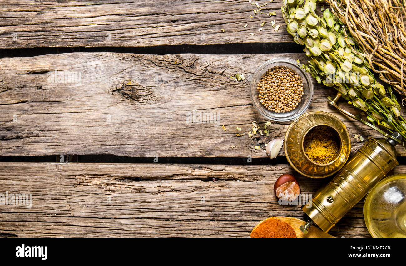 Download Mill With Aromatic Spices And Herbs On Wooden Background Free Space Stock Photo Alamy Yellowimages Mockups