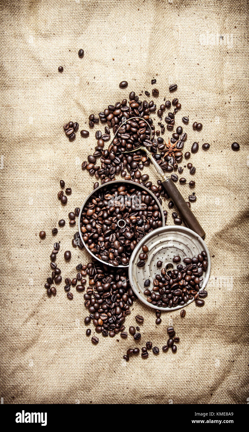 Roasted coffee beans with old tools. On textile sack Stock Photo - Alamy