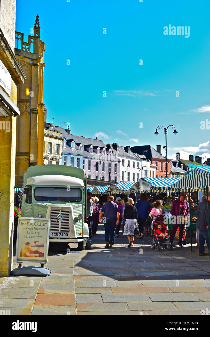 Cirencester Market Place, Gloucestershire, England on a busy Saturday. The old French Citroen HY van is converted to use as a coffee stall. Stock Photo