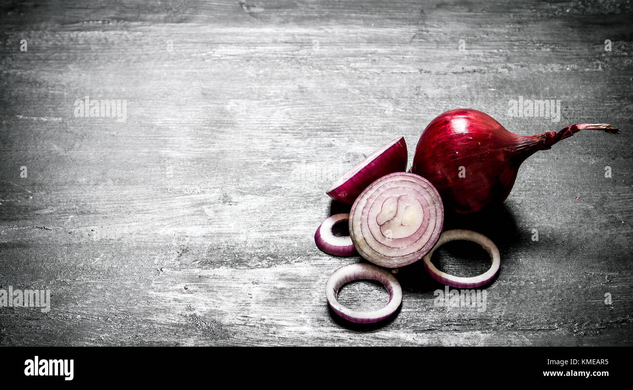 Fresh red onions. On the black rustic background Stock Photo - Alamy