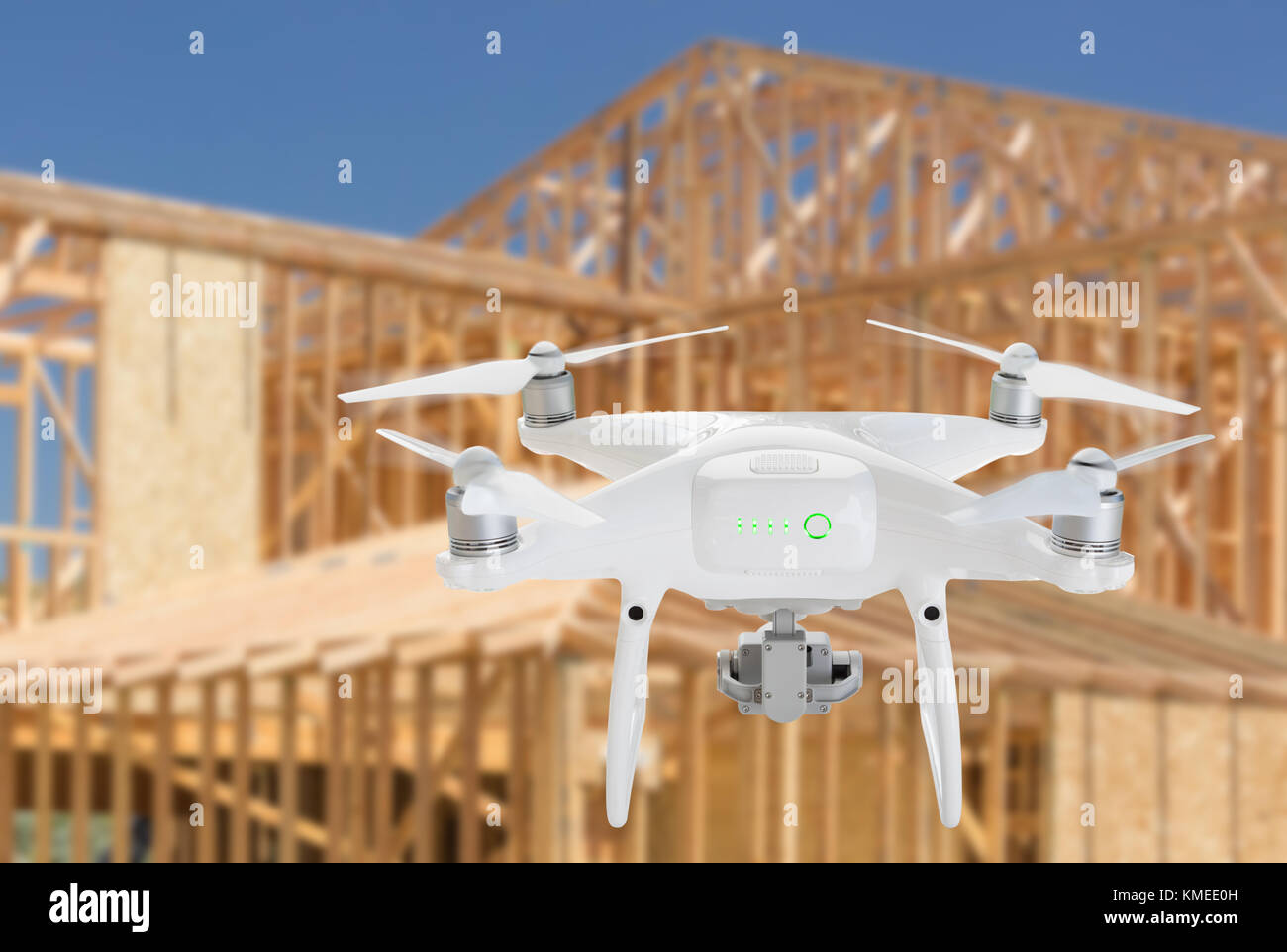 Unmanned Aircraft System (UAV) Quadcopter Drone In The Air Over Construction Site. Stock Photo