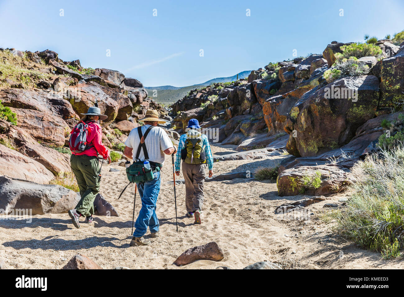 Sand Ridgecrest Three people walking on sand in Little Petroglyph Canyon,Ridgecrest ...