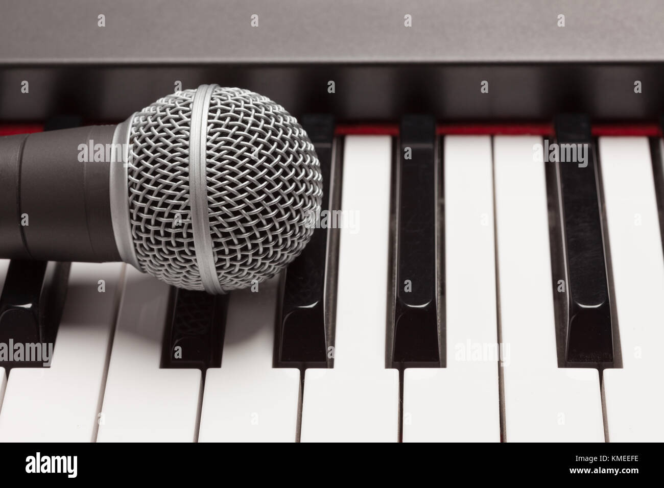 Microphone Laying on Electronic Synthesizer Keyboard Abstract Stock