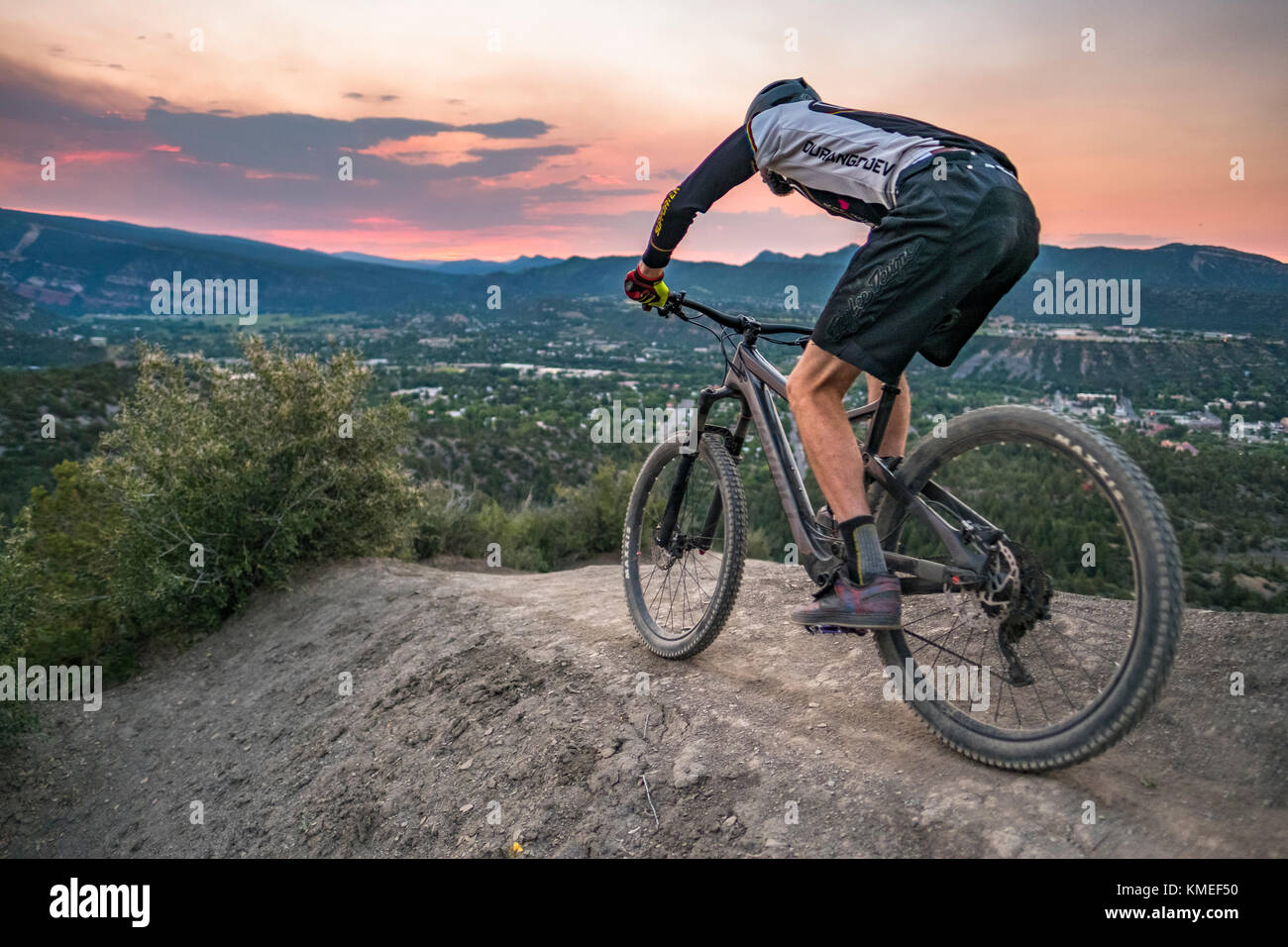 Male Mountain Biker in scenic landscape rides down Hogs back near Durango,Colorado,USA Stock Photo