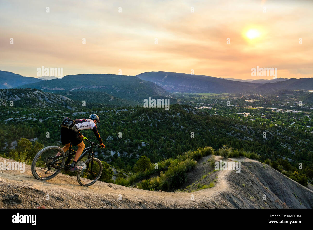 Male Mountain Biker in scenic landscape rides down Hogs back near Durango,Colorado Stock Photo