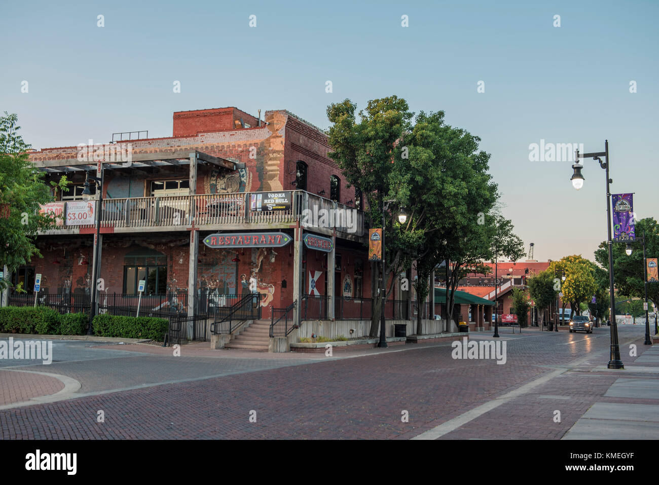 Street in old town of Wichita under clear sky with restaurant,Kansas