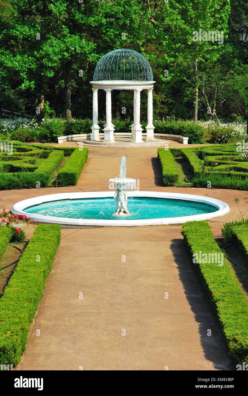 Water fountain and pavilion in a European-styled garden. A symbol of wealth, Western culture and sophistication. Stock Photo