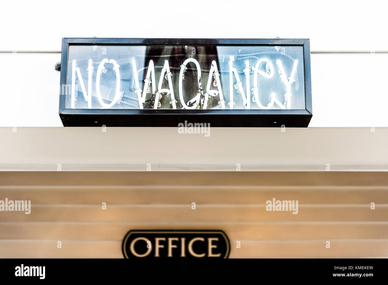 Closeup of electric neon No Vacancy sign on hotel exterior during day Stock Photo