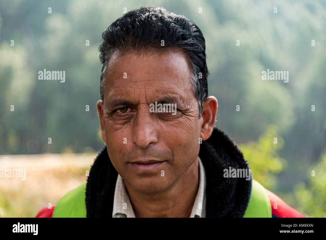 Portrait of a poor Indian man giving a serious expression. Stock Photo