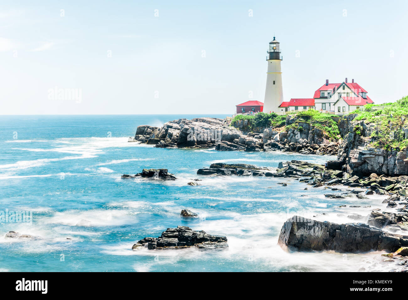 Cliff rocks side view shore with Portland Head Lighthouse in Fort