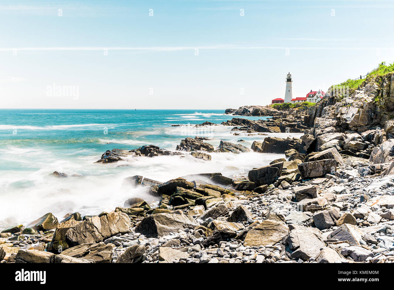 Cliff rocks side view shore with Portland Head Lighthouse in Fort
