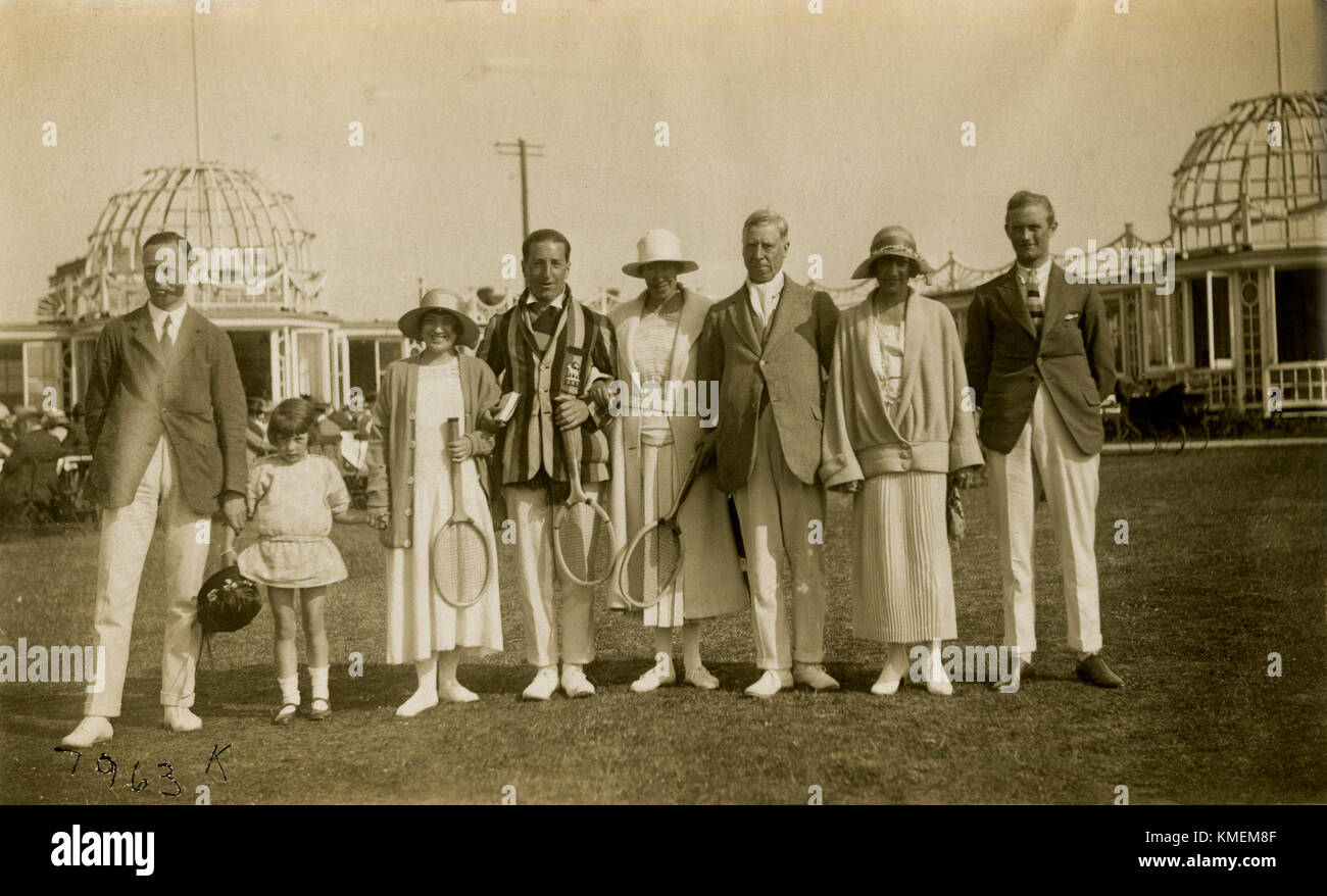 1920s, historical, dressed for a game of tennis, men and women tennis players with rackets line-up on the lawn for a picture before the match, England, Stock Photo