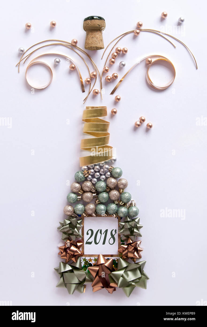 Open champagne bottle made from decorations including baubles and ...