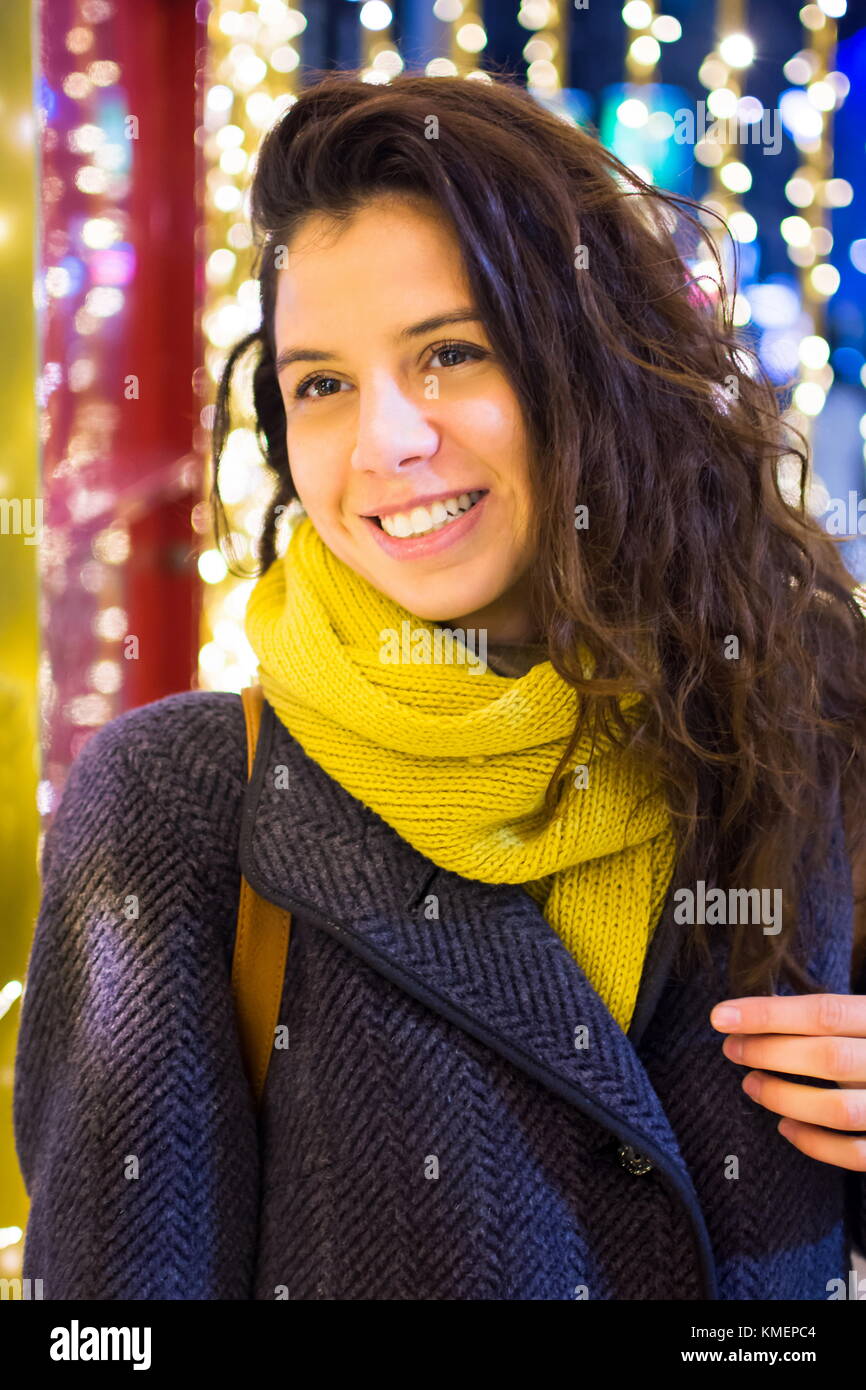 Portrait of a happy girl in festive illuminated environment Stock Photo