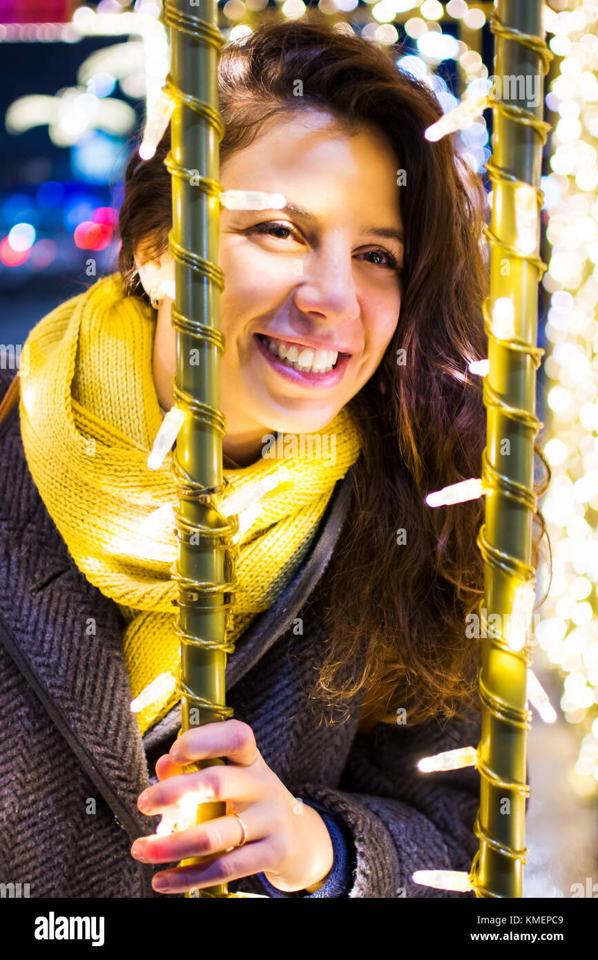 Portrait of a happy girl in festive illuminated environment Stock Photo