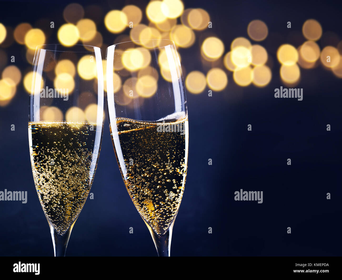 two champagne glasses ready to bring in the New Year Stock Photo
