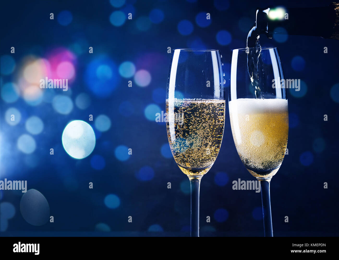 two champagne glasses ready to bring in the New Year Stock Photo - Alamy