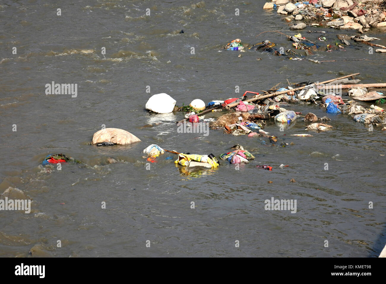 Plastic stuck in a river and accumulating Stock Photo Alamy