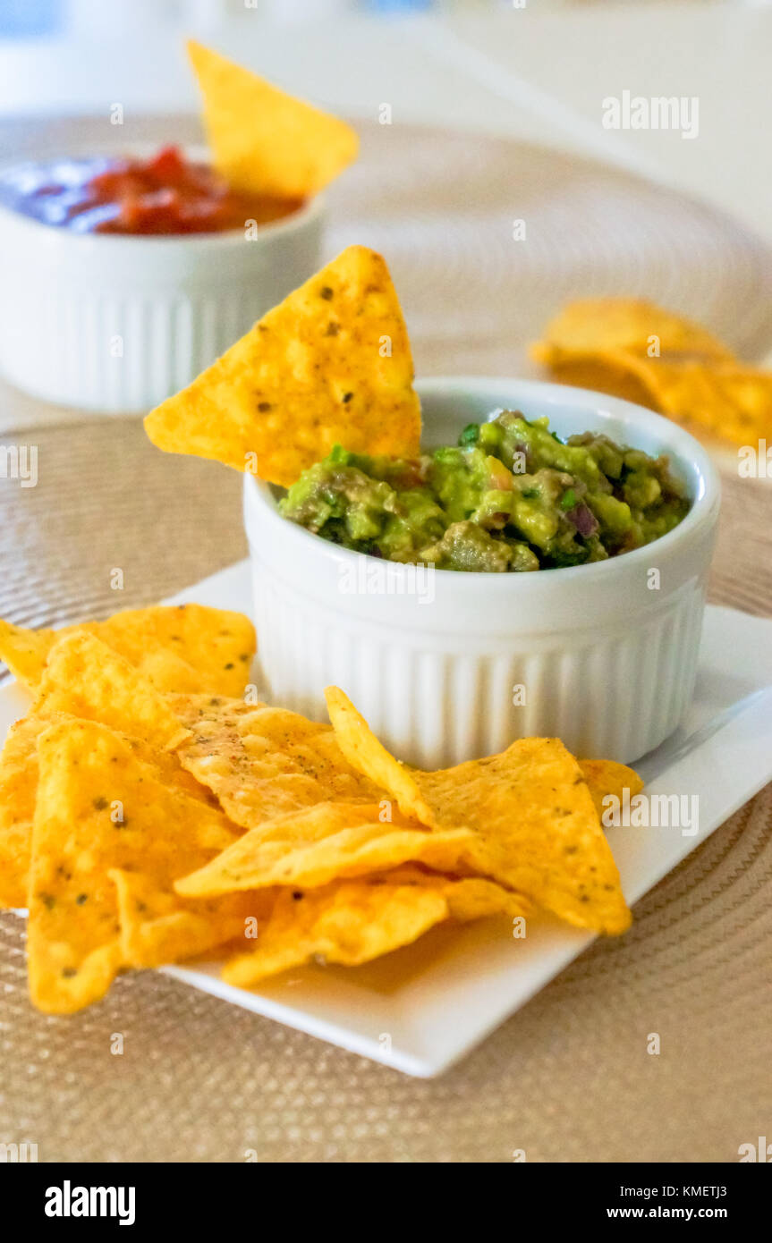 Mexican Nachos. Homemade Mexican Salsas With Corn Chips Stock Photo