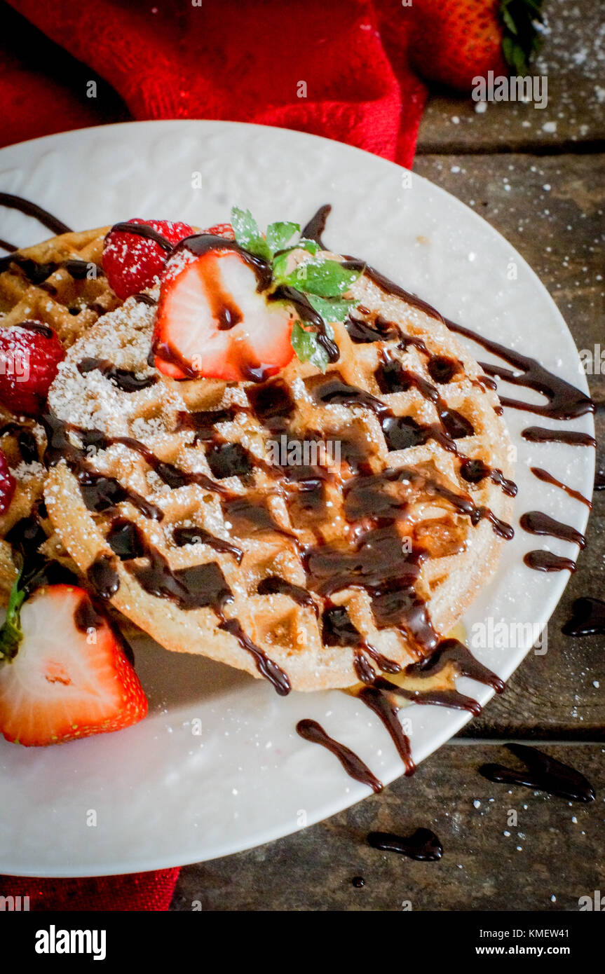 Waffles With Strawberries On Wooden Background Stock Photo - Alamy