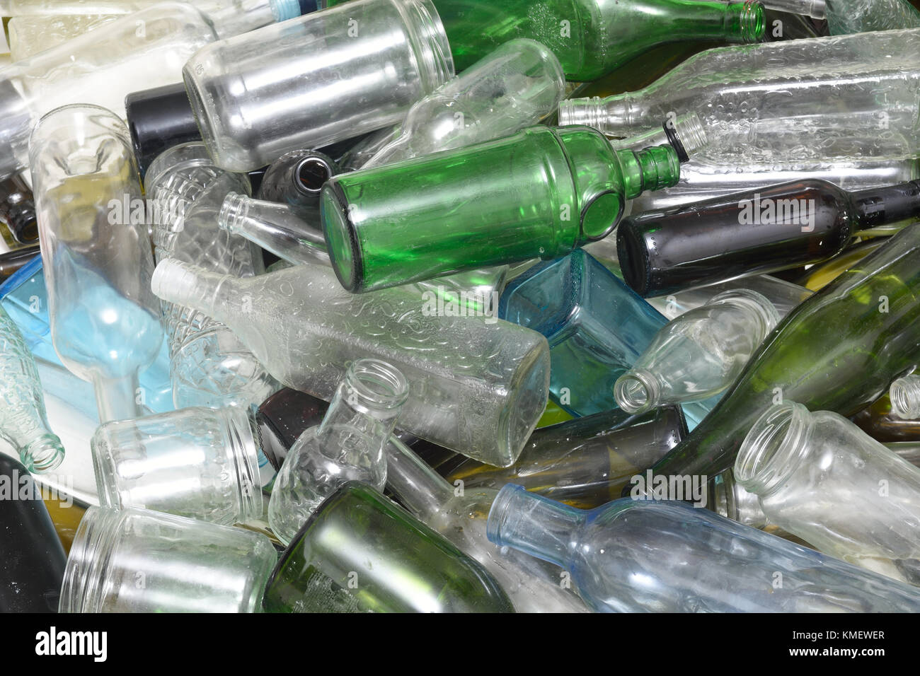 Glass bottles inside a glass recycling container Stock Photo Alamy