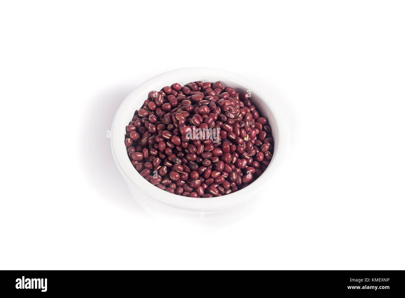 White bowl filled with atzuki beans Stock Photo