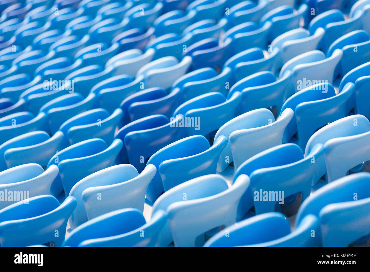 Rows of blue seats at football stadium. Convenient sitting for all. Stock Photo