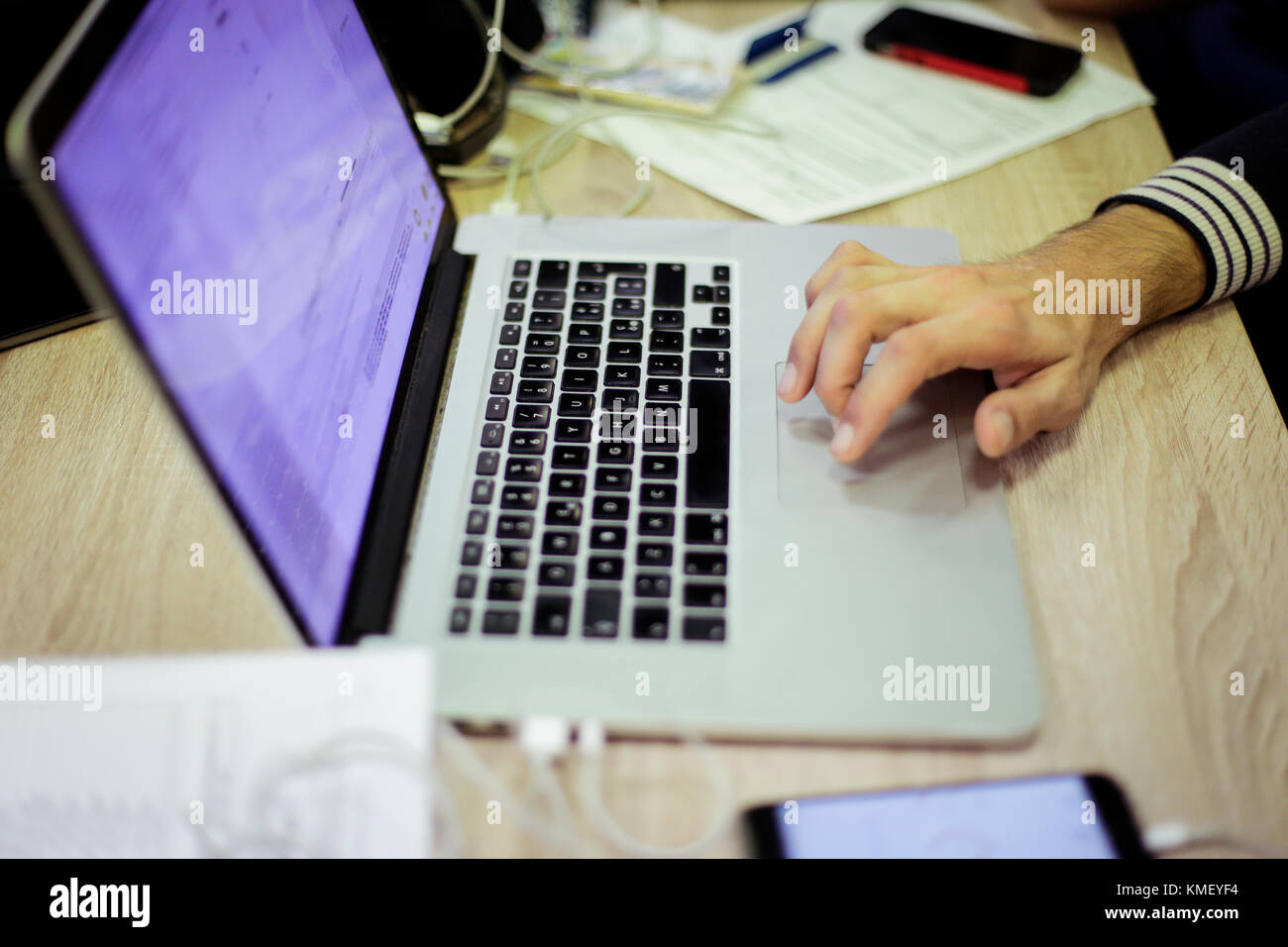 Man uses laptop for coding software Stock Photo - Alamy