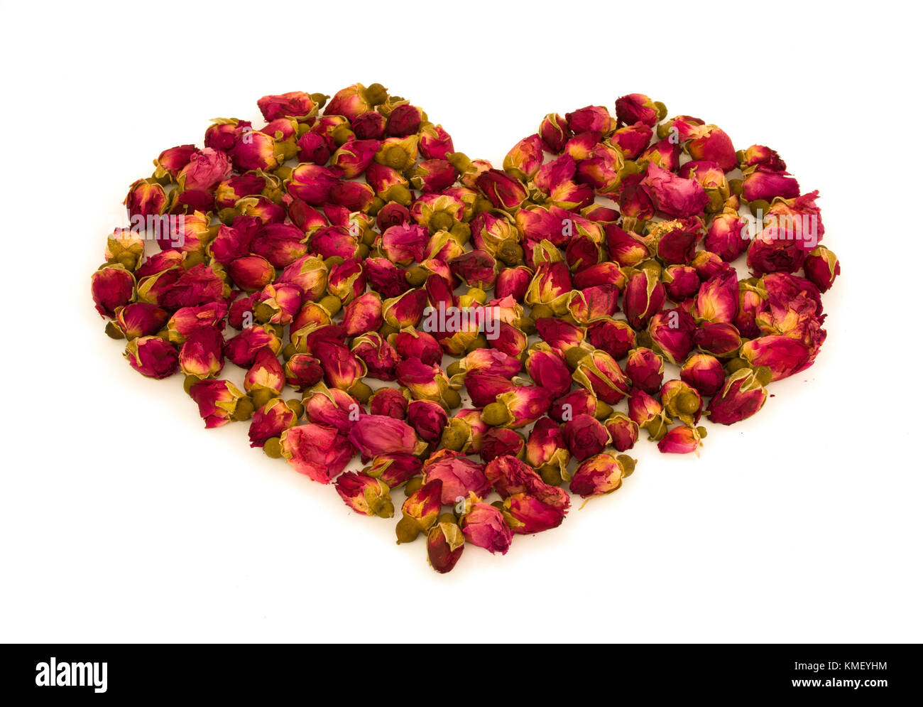 Heart shape made of rosebuds flowers isolated on white background - love symbol concept Stock Photo