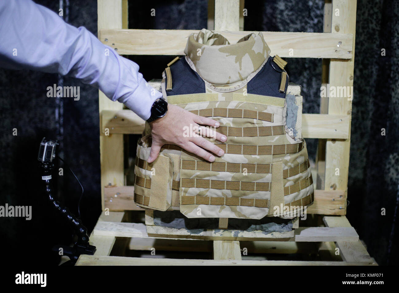 A man is inspecting a bulletproof military vest Stock Photo - Alamy