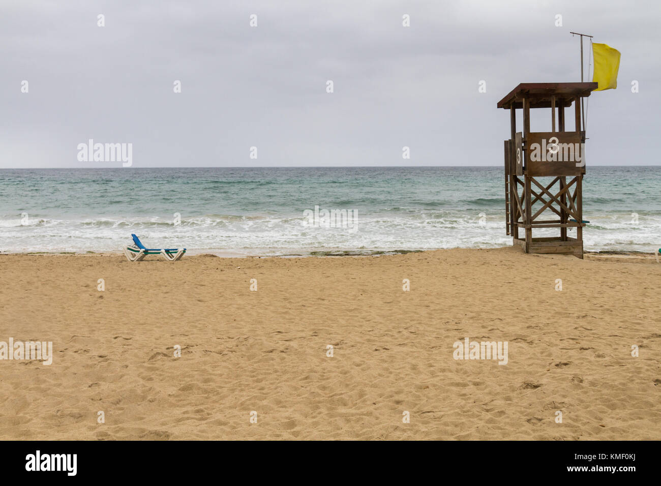 lifeguard tower on deserted beach on a rainy day Stock Photo