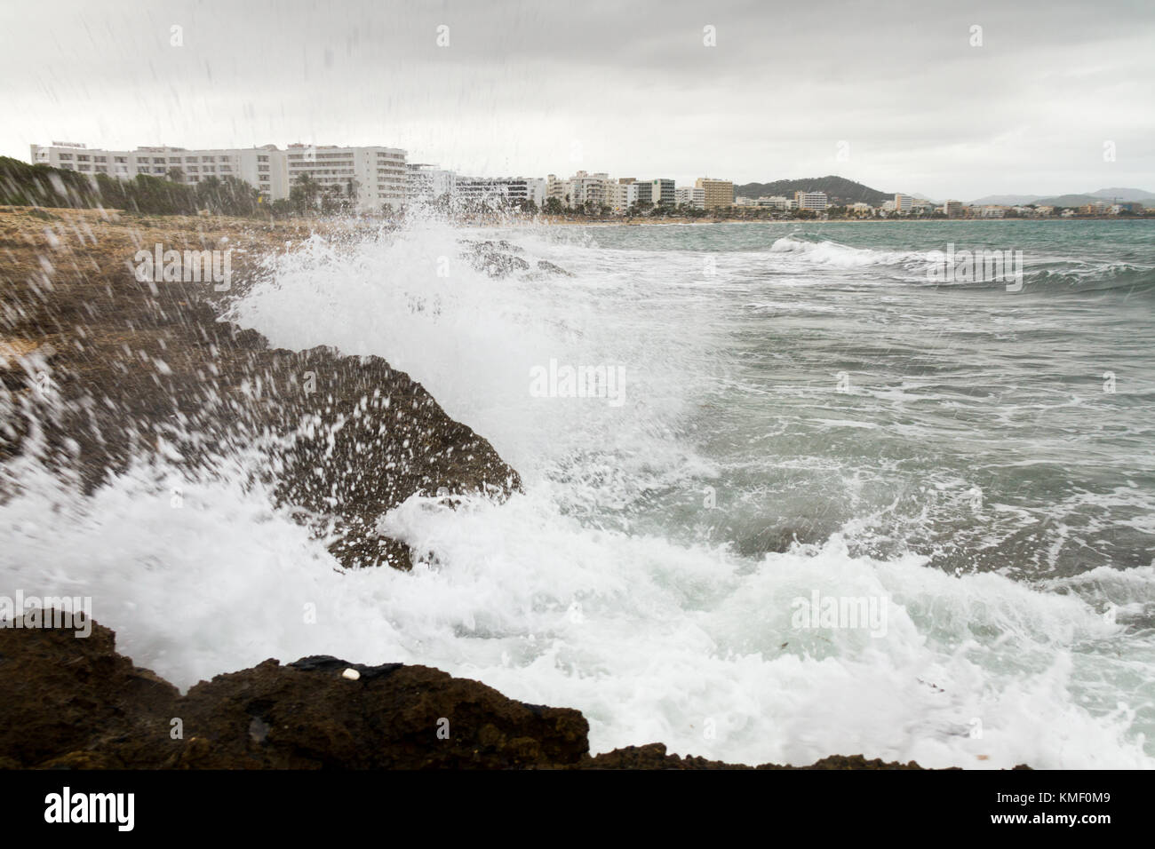 crashing waves against rocks in bad weather Stock Photo