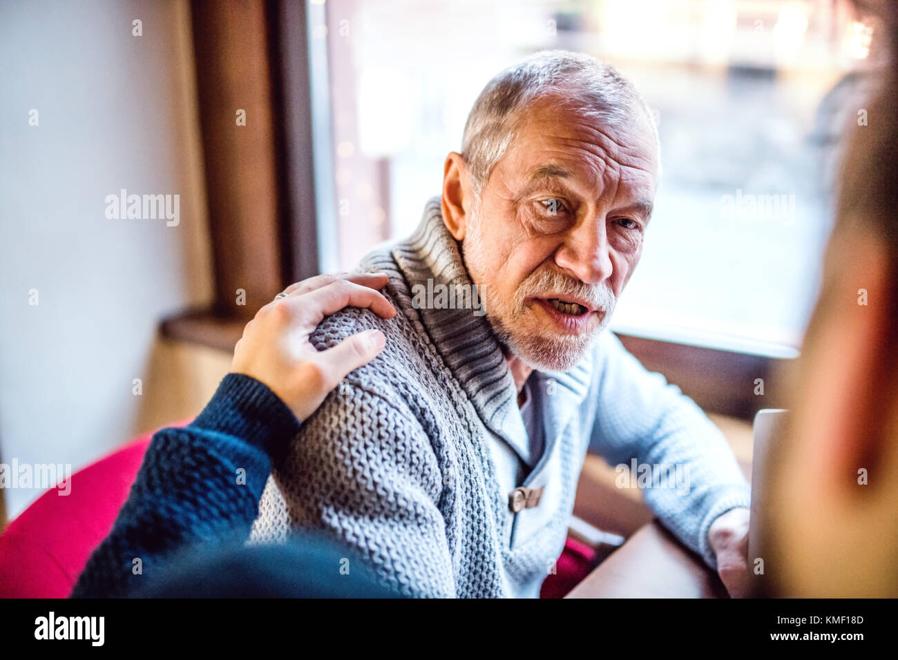 Senior father and his young son in a cafe Stock Photo - Alamy