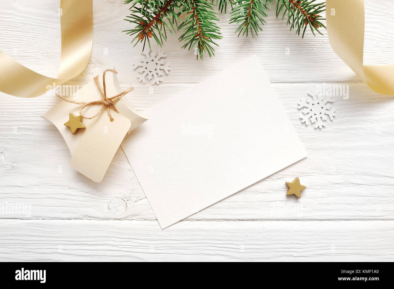 Mockup Christmas decor top view and gold ribbon, flatlay on a white wooden background, with place for your text Stock Photo