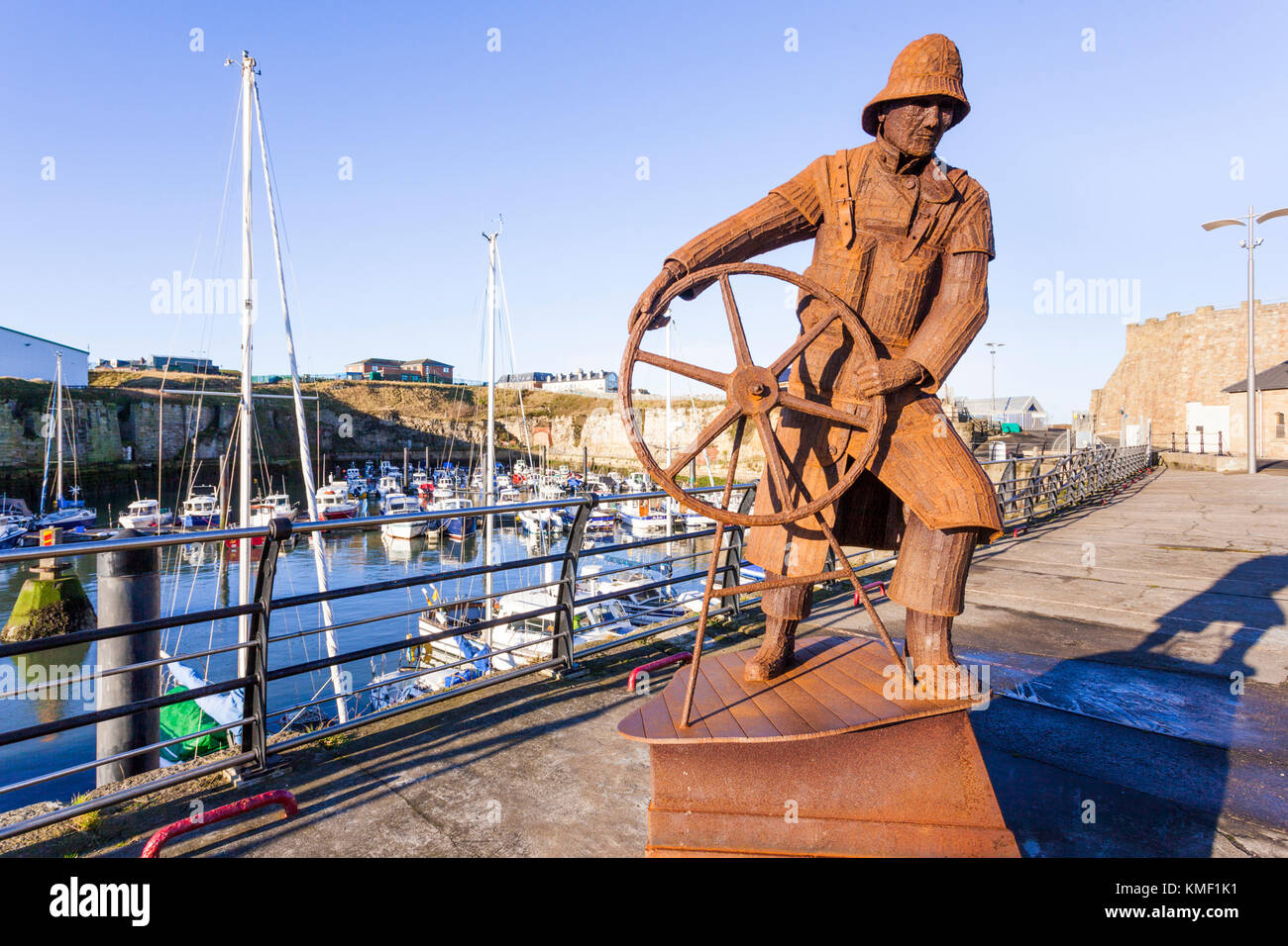The Coxswain, a sculpture by Ray Lonsdale honouring the work of the Royal National Lifeboat Institution, at Seaham harbour, Durham UK Stock Photo
