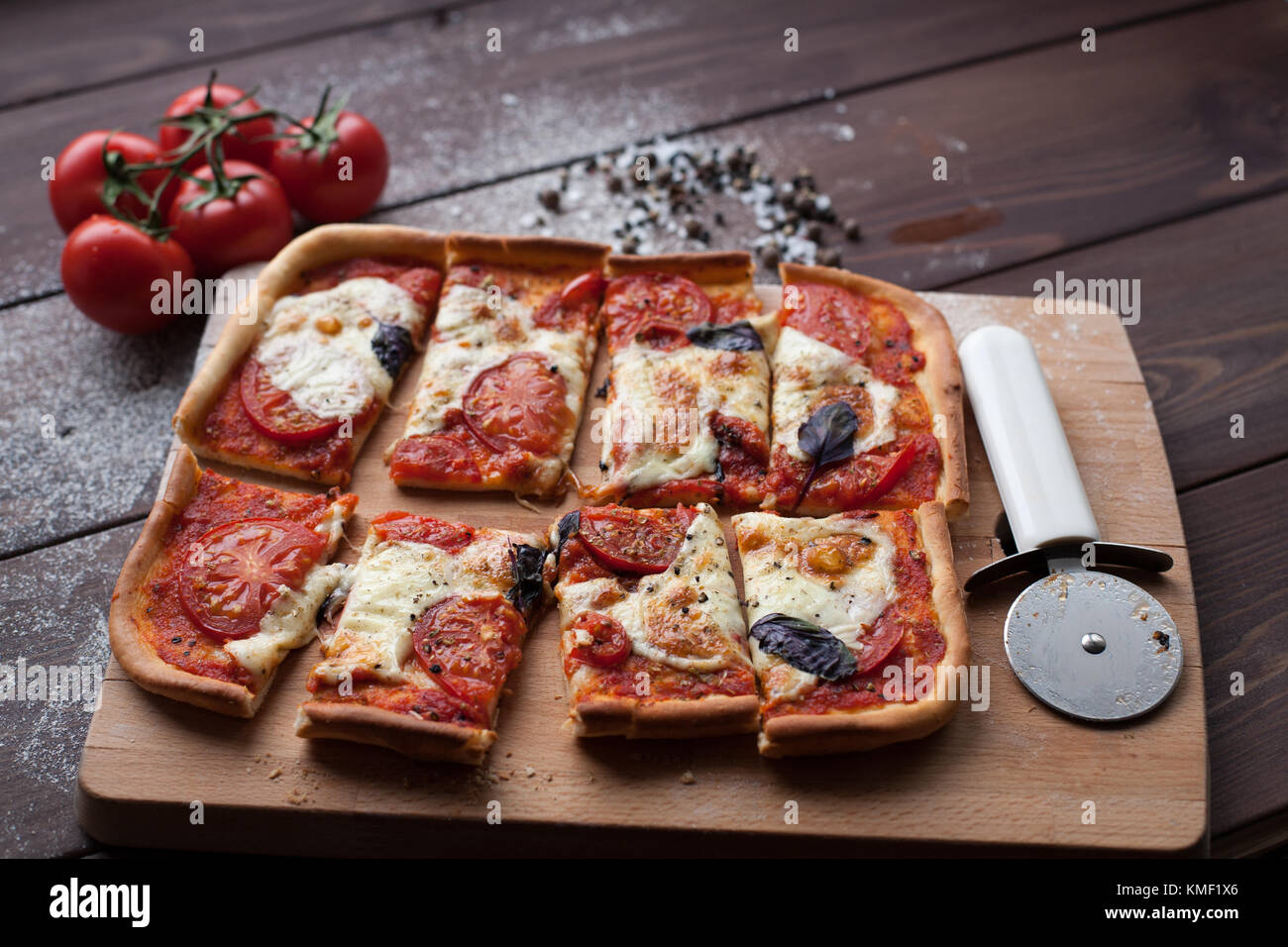 rustic italian pizza with mozzarella, cheese and basil leaves ...