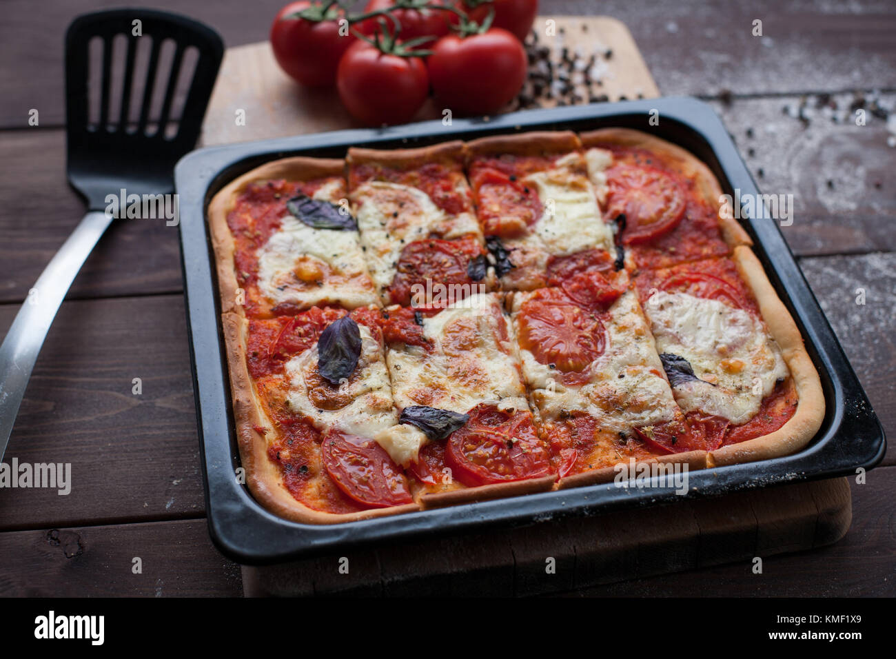 rustic italian pizza with mozzarella, cheese and basil leaves ...