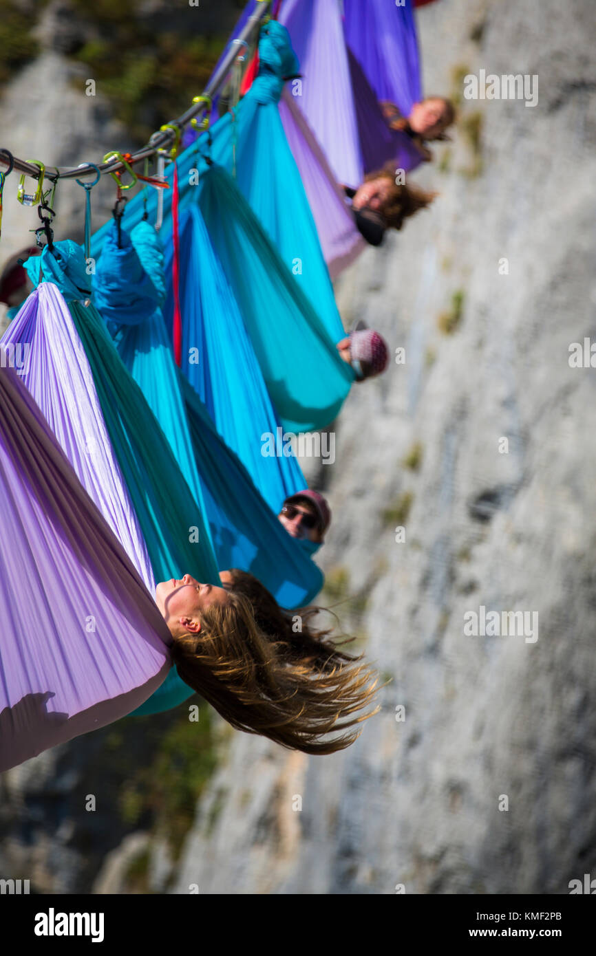 Side view of people lying in hammocks above mountains,Tijesno Canyon