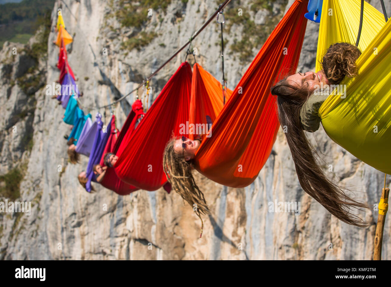 Side view of people lying in hammocks above mountains,Tijesno Canyon