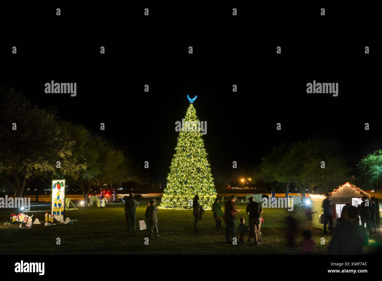 Members of the Joint Base San Antonio-Lackland community gather for the tree lighting ceremony at JBSA-Lackland Nov. 29, 2017.  The tree lighting ceremony is an annual event that occurs in JBSA-Lackland, Fort Sam Houston and Randolph. Stock Photo