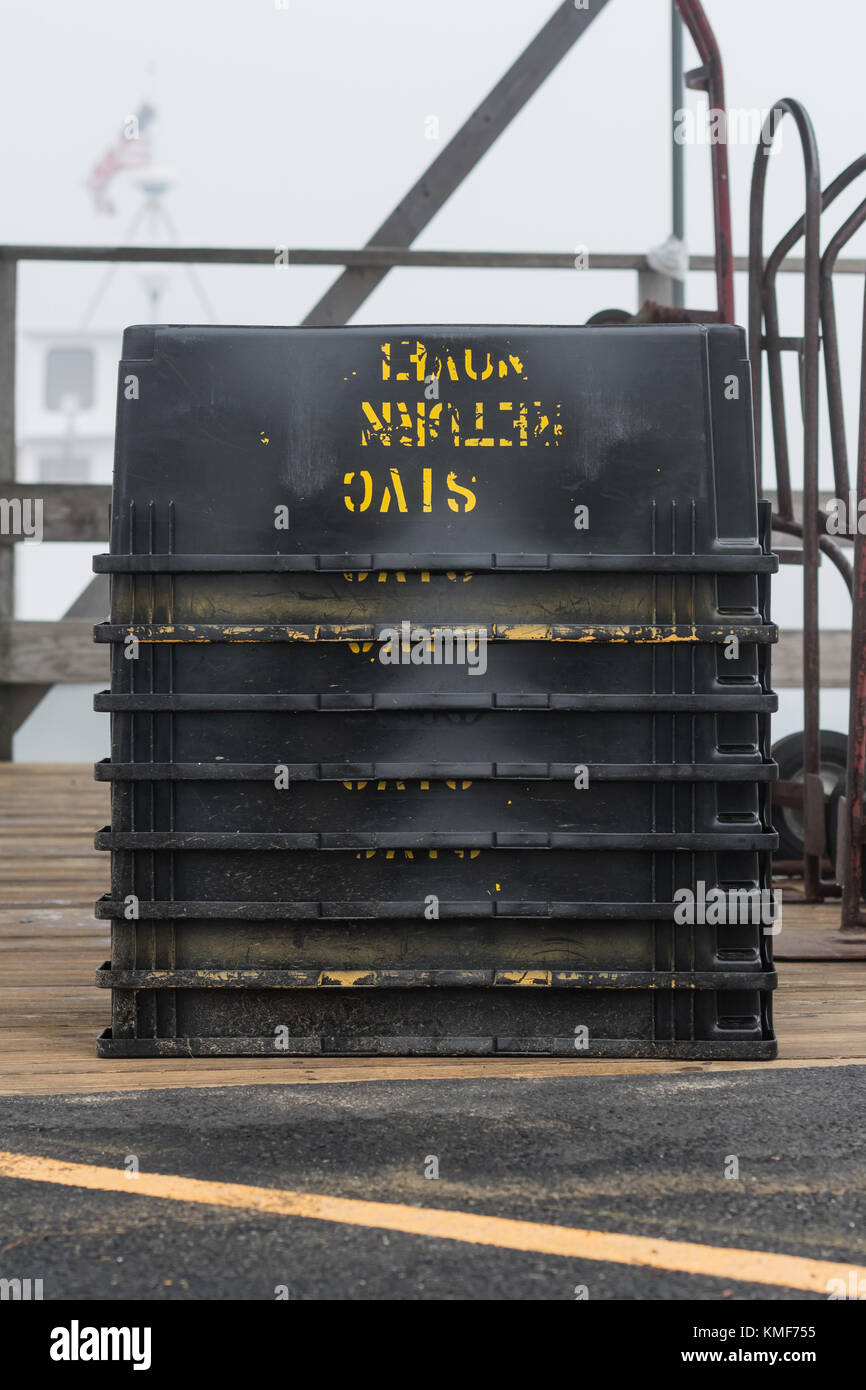 Black Bins Stacked on Dock on foggy day Stock Photo Alamy