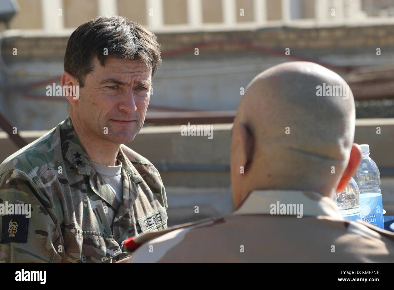 British Army Maj. Gen. Felix Gedney, deputy commanding general for strategy and support with Combined Joint Task Force – Operation Inherent Resolve, speaks with Iraqi security force Staff Lt. Gen. Wa’ad Zainl Saleh, senior secretary to the Iraqi chief of defense, during a High Level Committee lunch in Baghdad, Iraq, Dec. 5, 2017. The committee discussed the way forward for the Coalition’s continued support of the Iraqi security forces. CJTF-OIR is the global Coalition to defeat ISIS in Iraq and Syria. Stock Photo