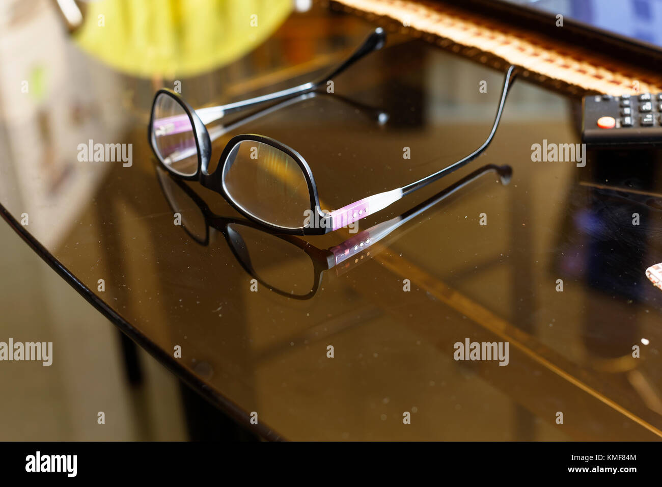 Glasses on a desk in the office. Glasses on a transparent desk in the