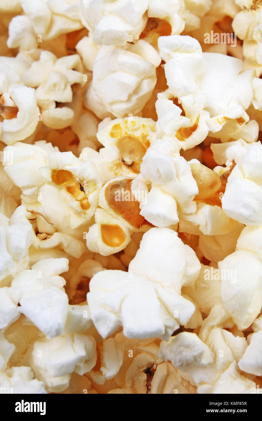 Scattered salted popcorn, food texture background. Fastfood popular