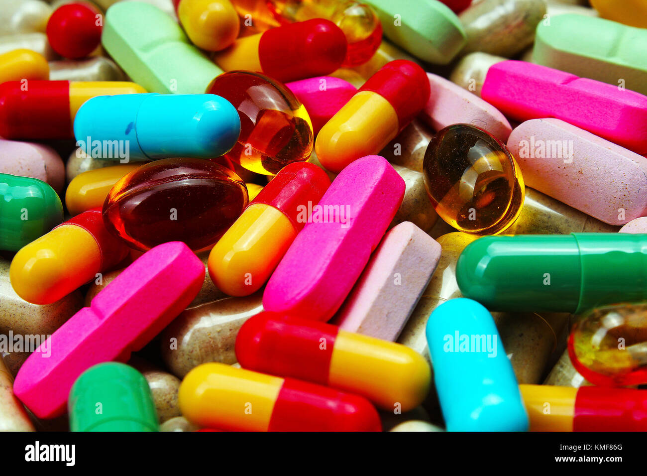 Medical or vitamin pills. Colorful medicine pills as texture. Pill pattern background. Stock Photo