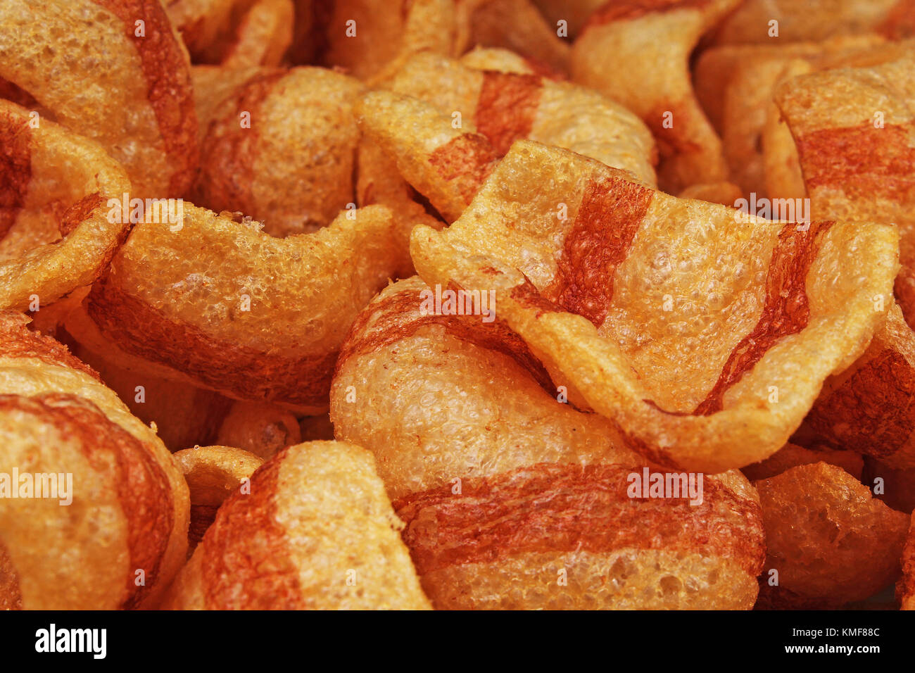 Bacon flavored snacks. Bacon chips flips background pattern texture