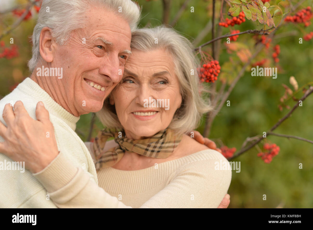 senior couple hugging in the park Stock Photo - Alamy