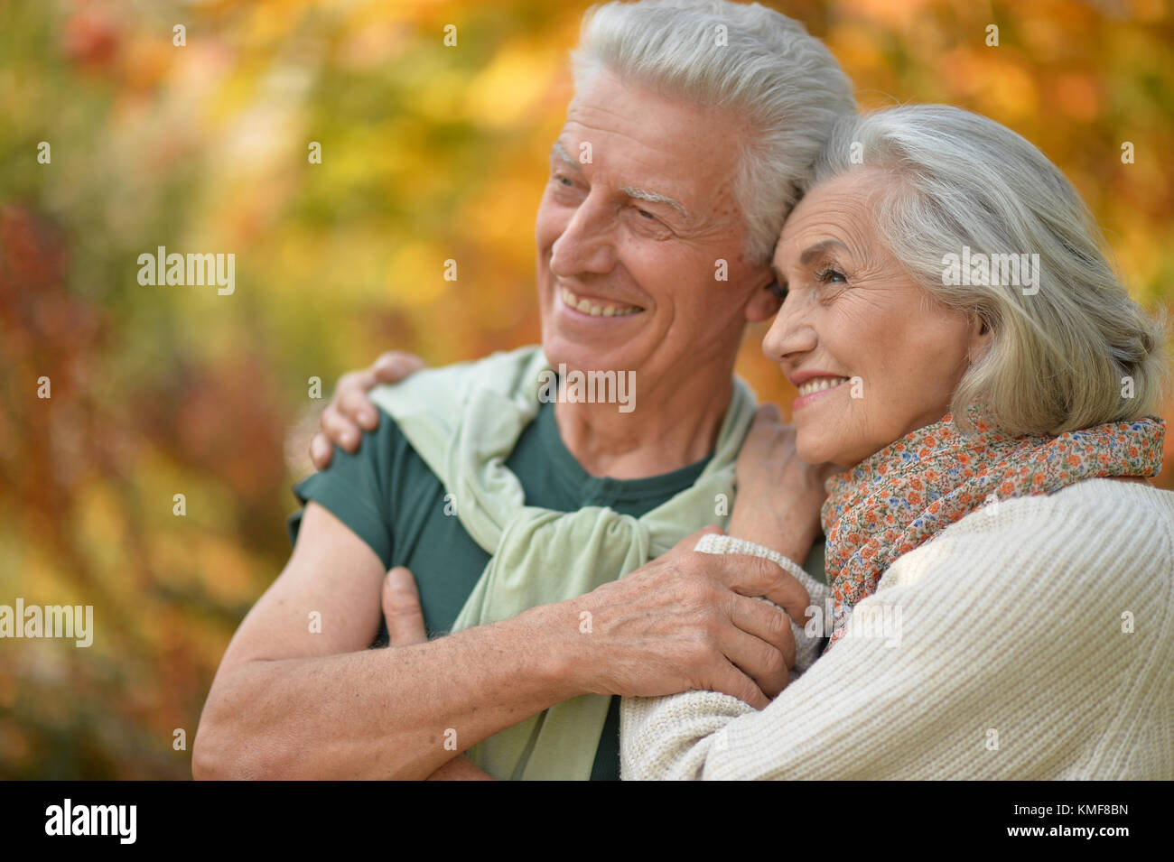 Senior couple in autumn park Stock Photo - Alamy