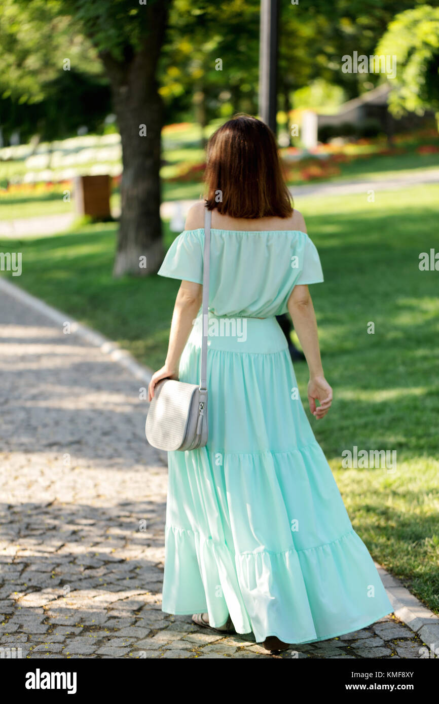 Woman long skirt walking away hires stock photography and images Alamy